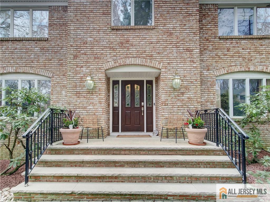 4 Cherokee Road East Brunswick, NJ 08816 - Photo 4 of 40 a view of a brick wall and potted plant
