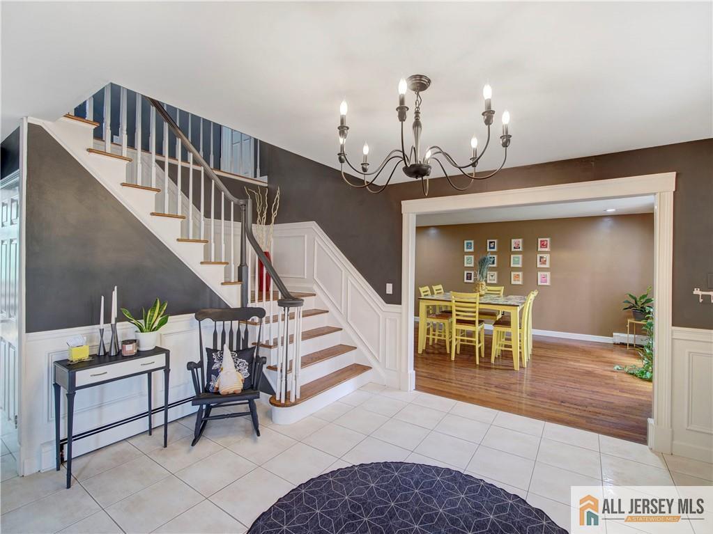 4 Cherokee Road East Brunswick, NJ 08816 - Photo 6 of 40 a view of entryway and hall with dining room