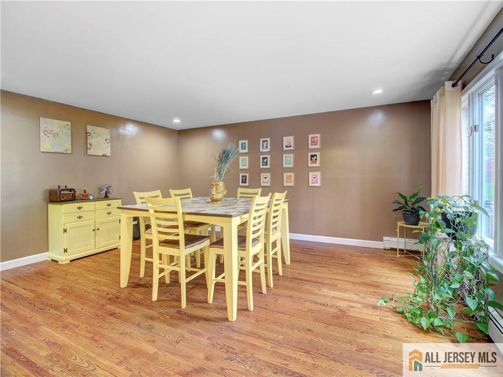 4 Cherokee Road East Brunswick, NJ 08816 - Photo 7 of 40 a dining room with furniture potted plants and wooden floor