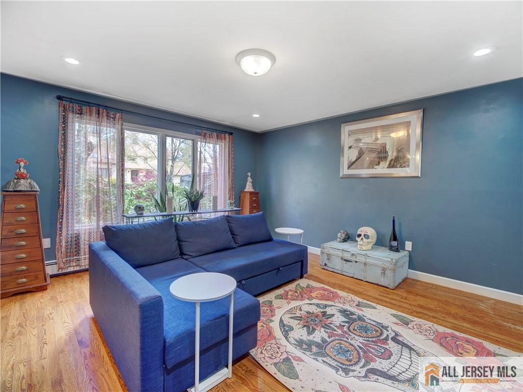 4 Cherokee Road East Brunswick, NJ 08816 - Photo 8 of 40 a living room with furniture and a window