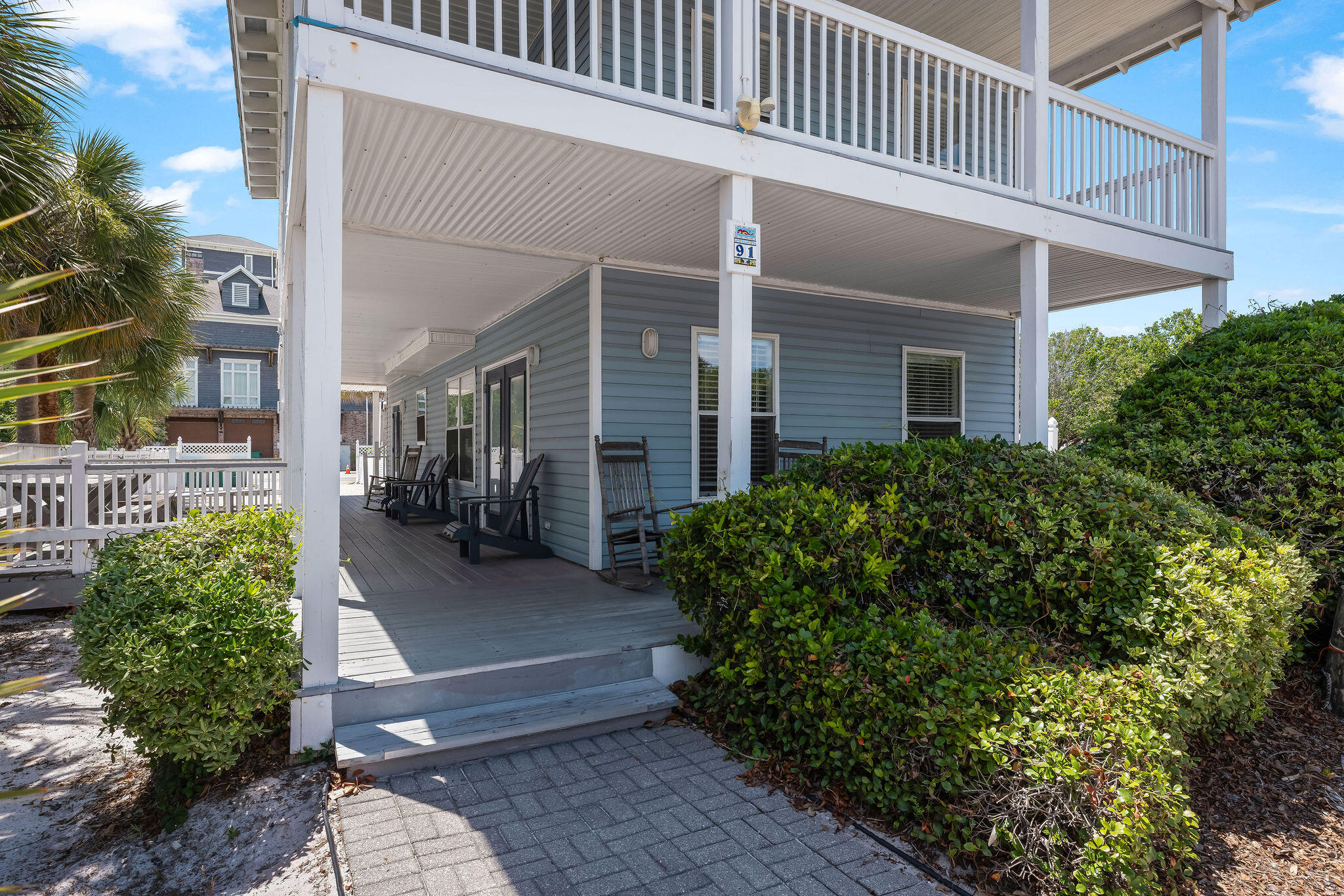 91 Matthew Boulevard Destin, FL 32541 - Photo 16 of 85 a front view of a house with garden