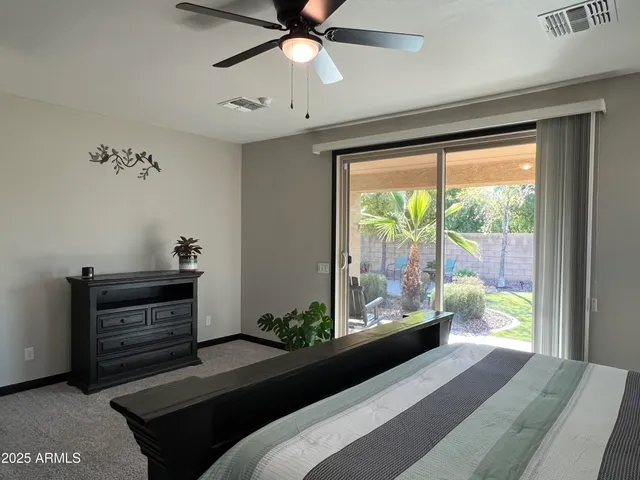 a bathroom with a granite countertop sink a mirror and a shower