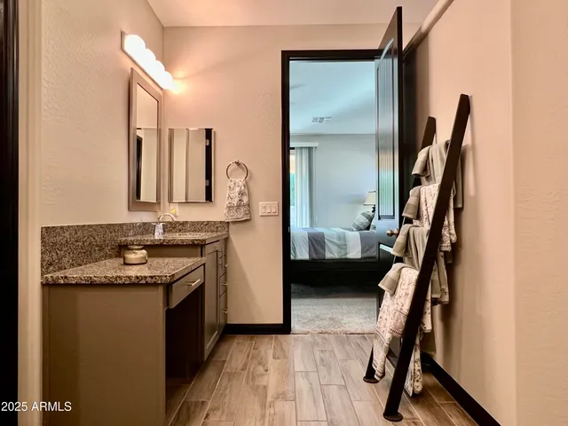 a living room with furniture and a potted plant