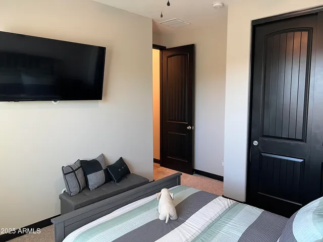 a view of a wooden door with a house