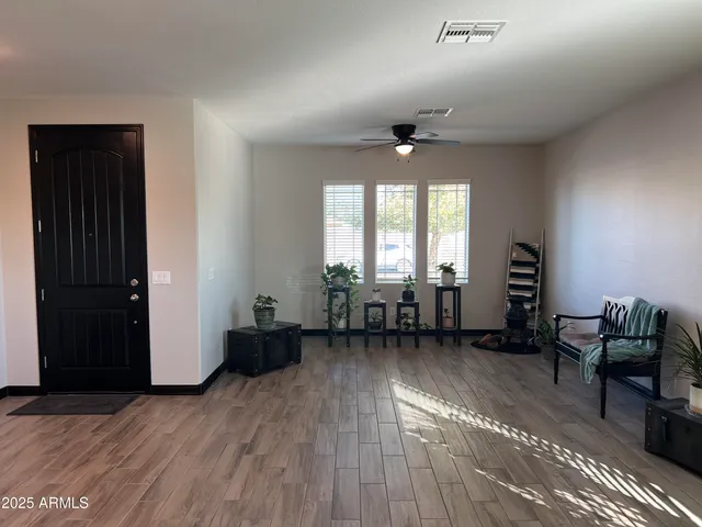 a living room with furniture and a window