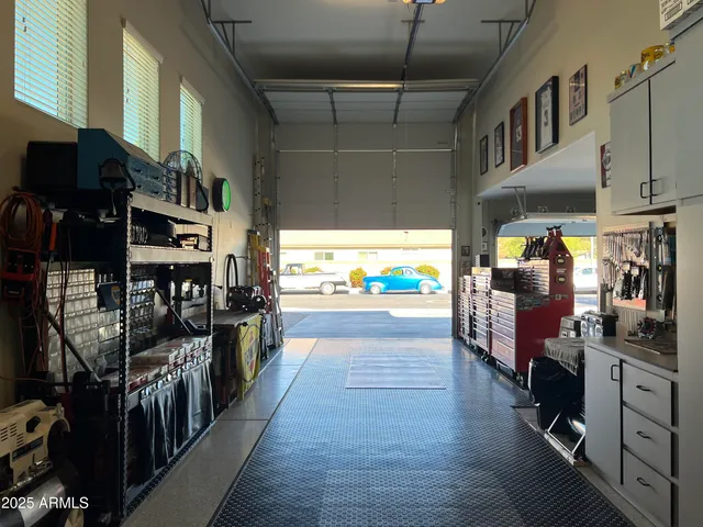 a view of a chairs and table in backyard