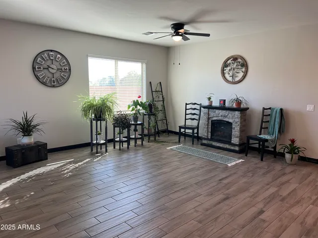 a view of a livingroom with furniture and a fireplace