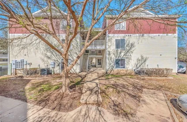 a backyard of a house with large trees