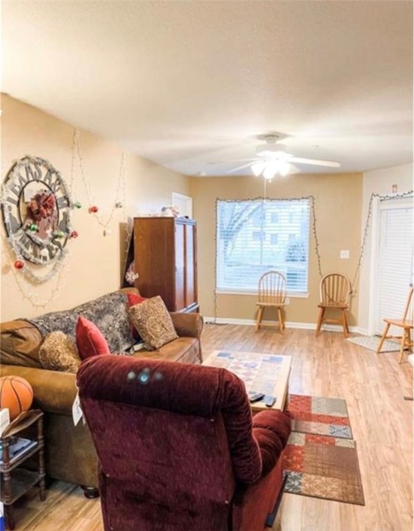 521 Southwest Parkway, Unit 103 College Station, TX 77840 - Photo 2 of 6 a living room with furniture and a large window