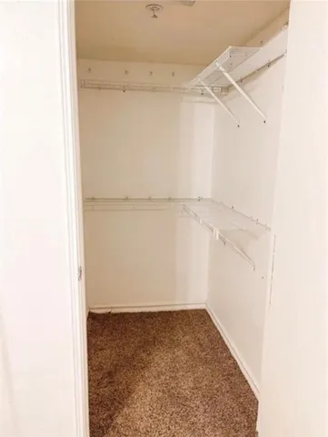 a view of an empty walk in closet