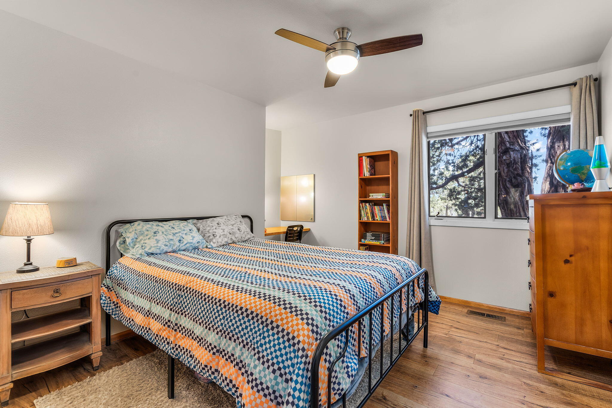 64620 McGrath Road Bend, OR 97701 - Photo 17 of 28 a bedroom with a bed and a window
