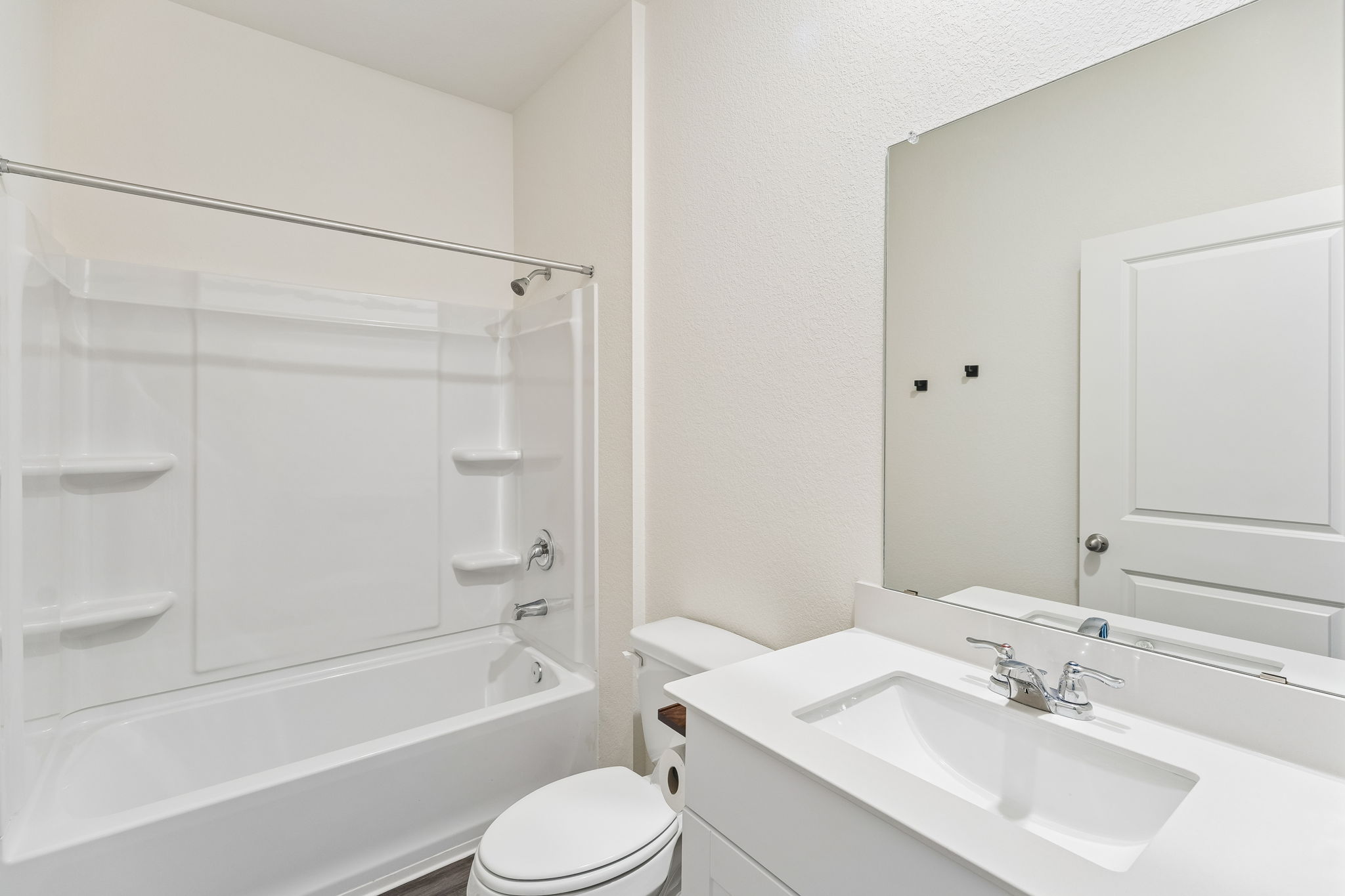 550 Thistle Lane Maxwell, TX 78656 - Photo 12 of 29 a bathroom with a bathtub shower sink vanity mirror and toilet