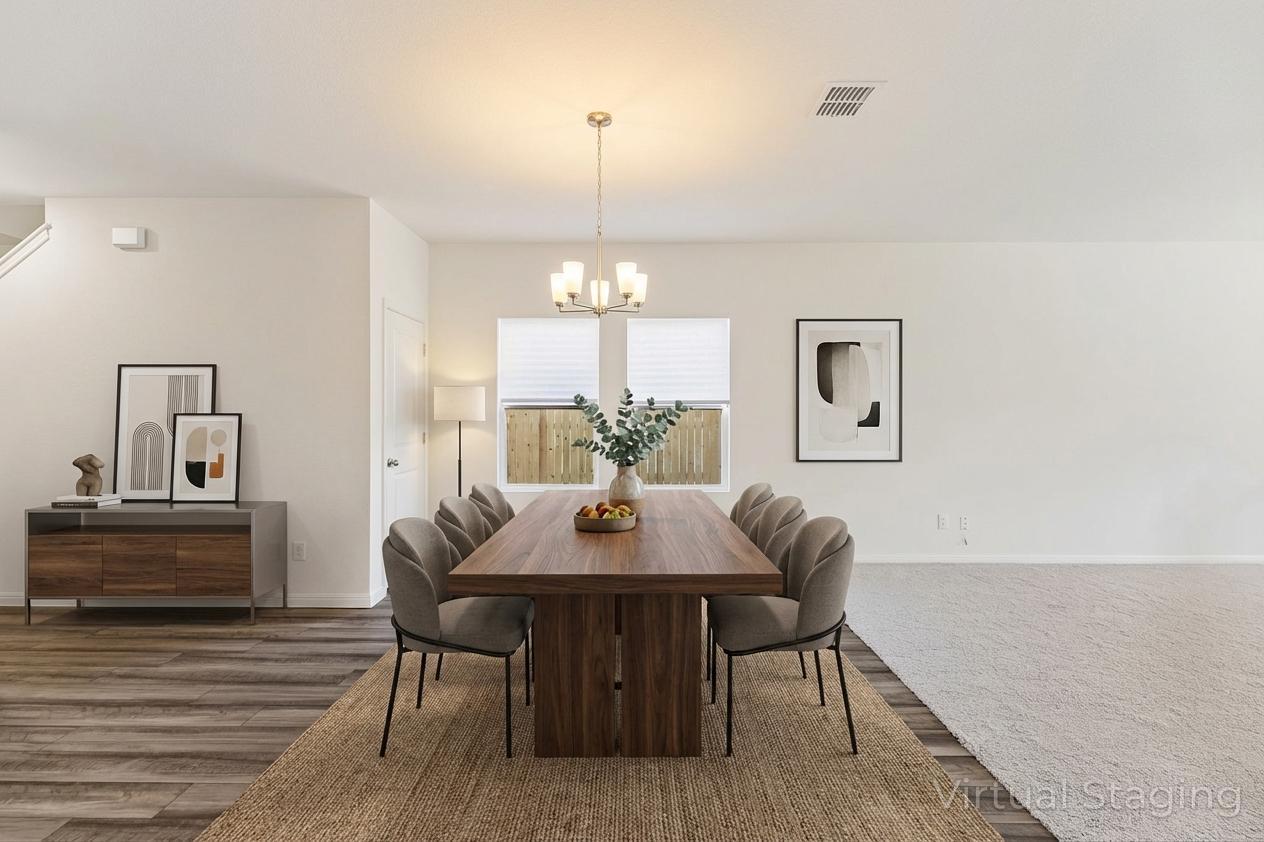 550 Thistle Lane Maxwell, TX 78656 - Photo 9 of 29 a view of a dining room with furniture and wooden floor