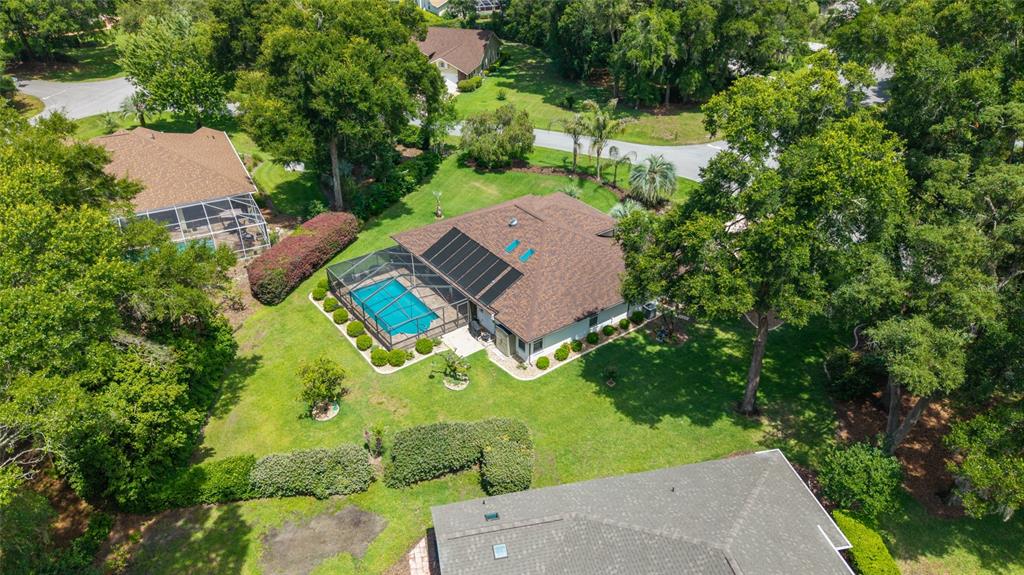 18825 Southwest 93rd Loop Dunnellon, FL 34432 - Photo 70 of 85 an aerial view of a house with a yard and lake view