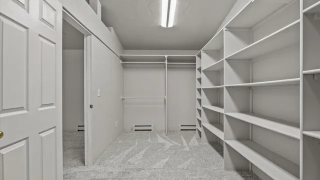 a view of an empty walk in closet