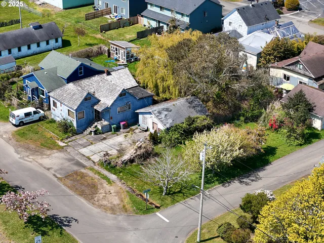an aerial view of multiple houses with yard