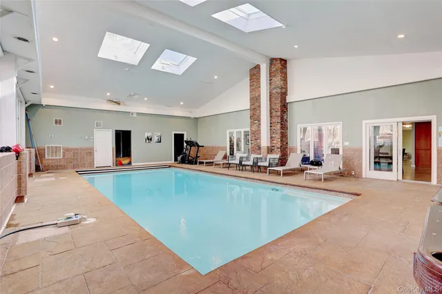 a view of a living room and kitchen with furniture