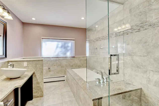 a bathroom with a bathtub and a sink