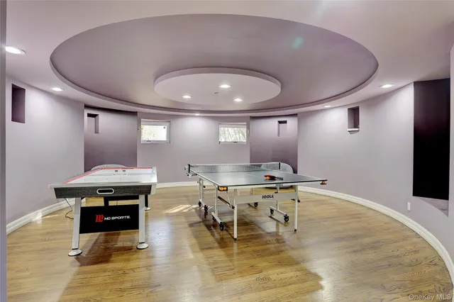 a living room with lots of furniture and a glass door