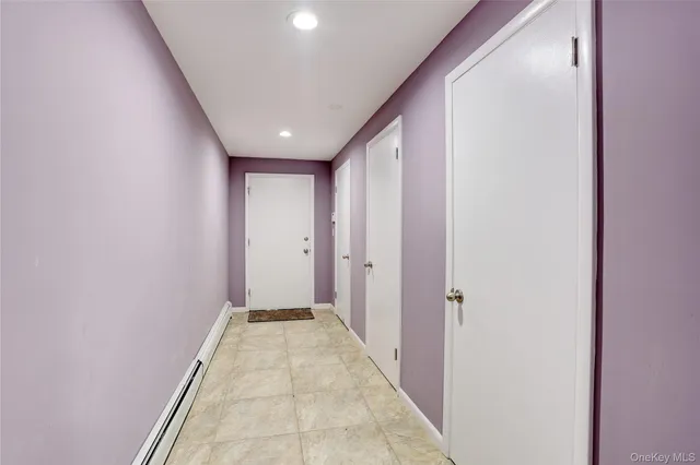 a view of a hallway with a glass door