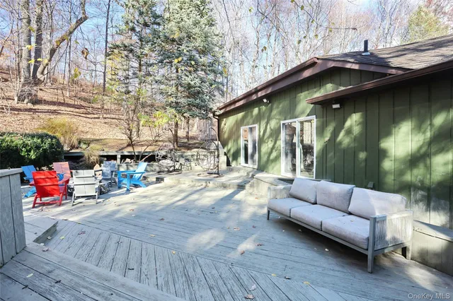 a view of outdoor seating space with wooden floor and seating