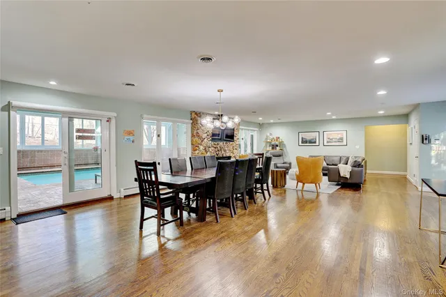 a view of a dining area with furniture window and wooden floor