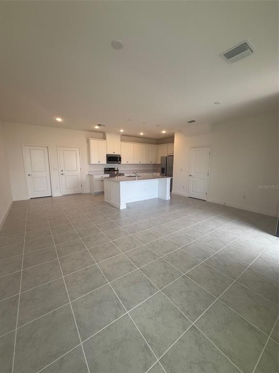 4810 Prairie Preserve Run St. Cloud, FL 34772 - Photo 4 of 4 a view of a kitchen with a sink and cabinets