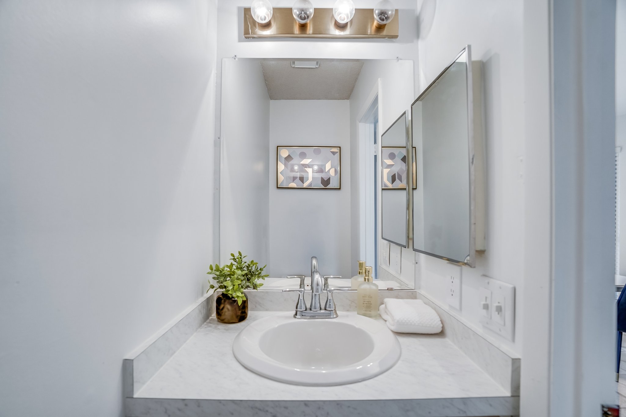 Undisclosed Address Austin, TX 78758 - Photo 11 of 19 a bathroom with a sink and a mirror