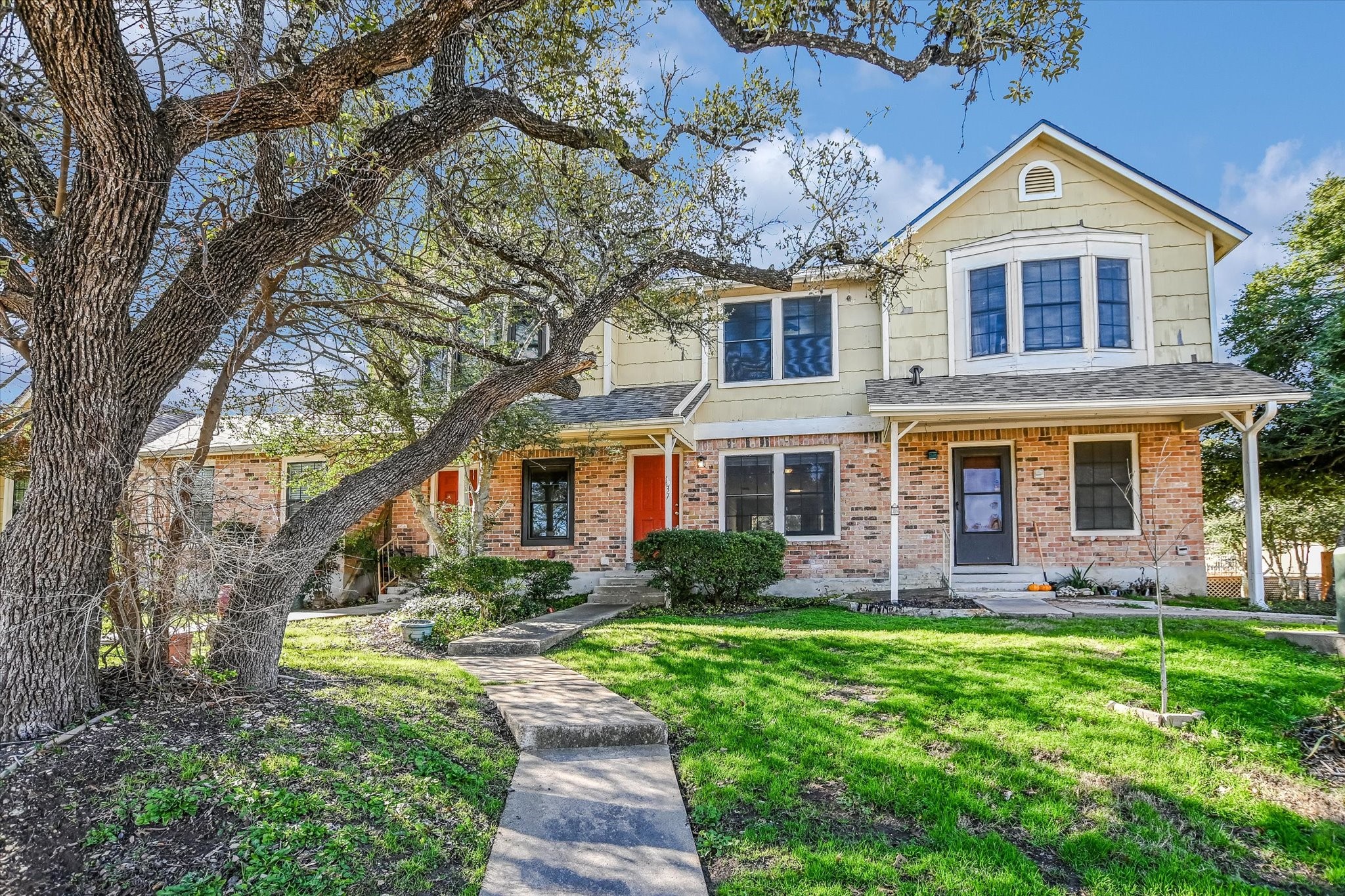 Undisclosed Address Austin, TX 78758 - Photo 12 of 19 a front view of a house with garden