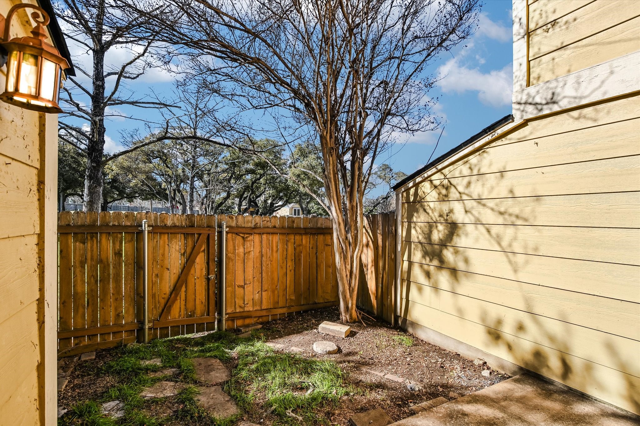 Undisclosed Address Austin, TX 78758 - Photo 3 of 19 a view of a backyard of the house
