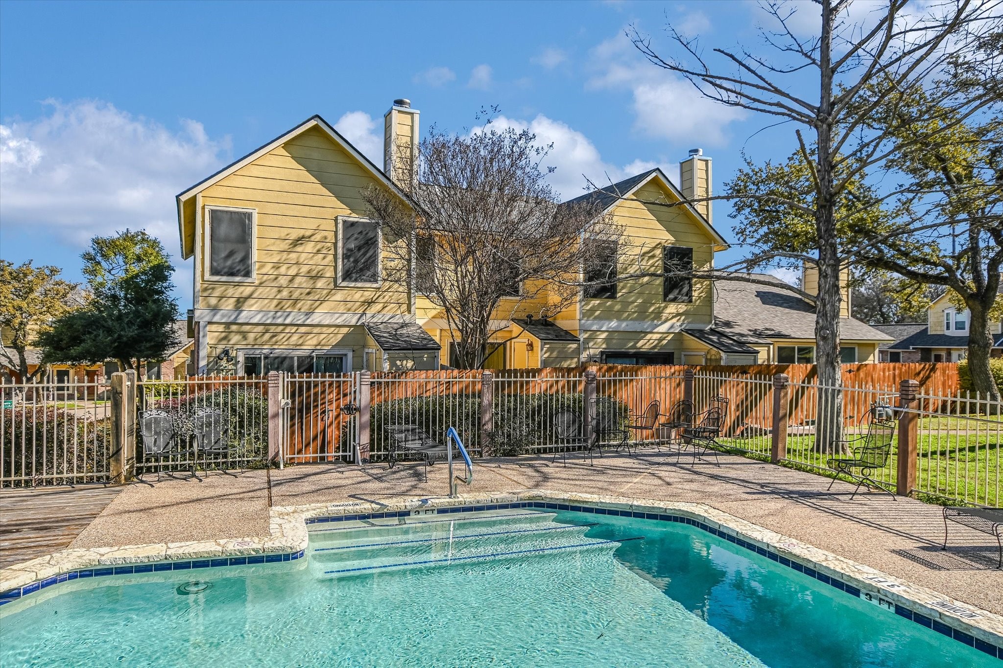 Undisclosed Address Austin, TX 78758 - Photo 4 of 19 a view of a house with swimming pool