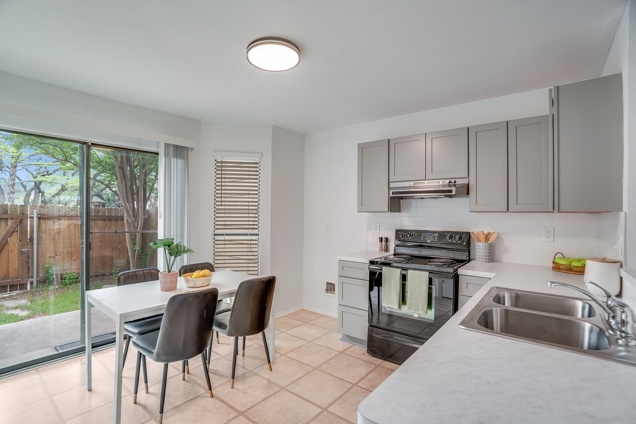 Undisclosed Address Austin, TX 78758 - Photo 6 of 19 a kitchen that has a sink and a stove top oven