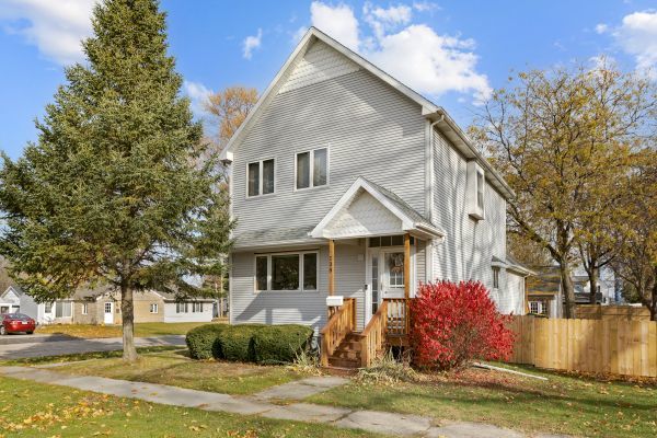 138 Stiles Street Genoa, IL 60135 - Photo 1 of 1 a front view of a house with a yard