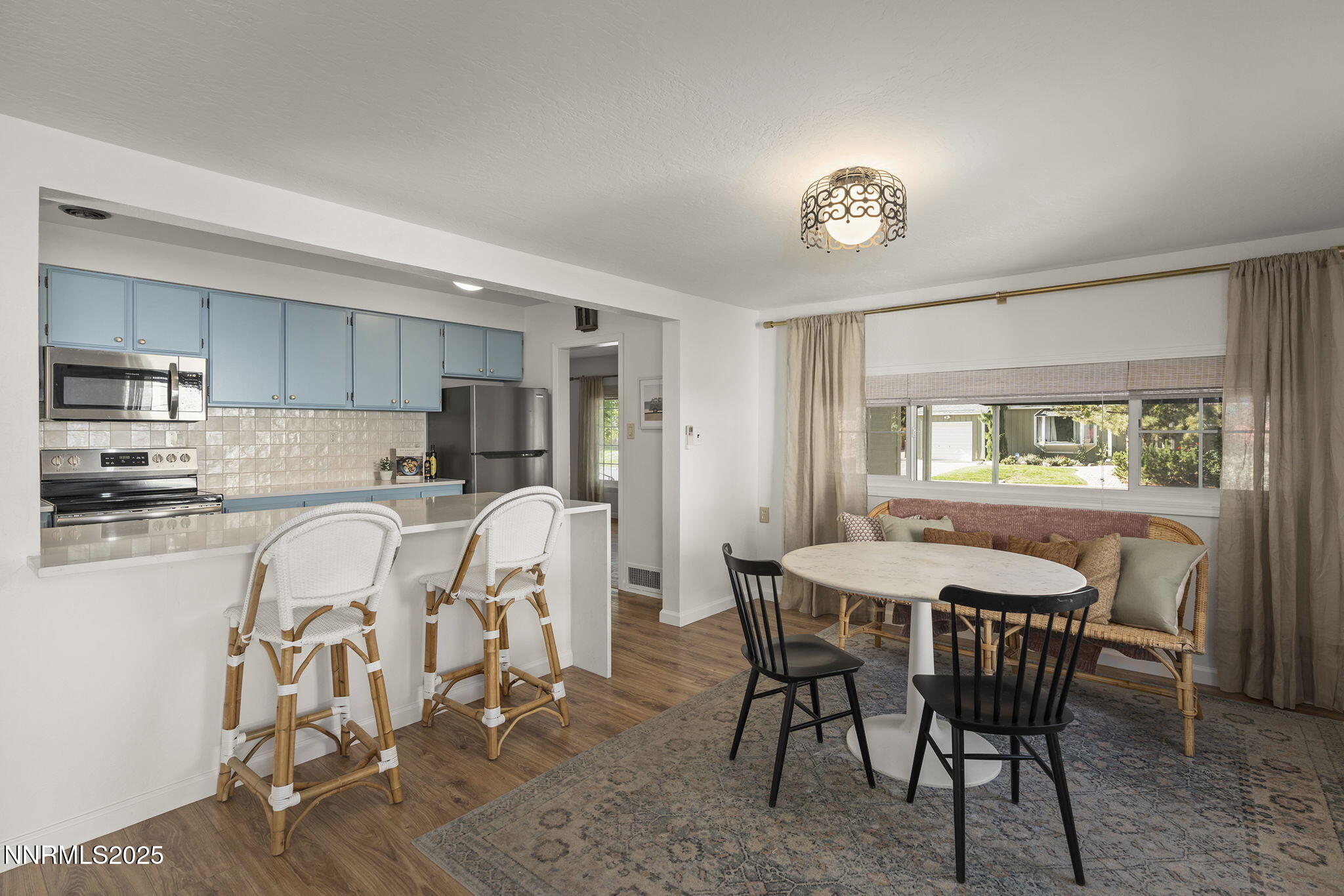 640 Robin Street Reno, NV 89509 - Photo 13 of 25 a view of a dining room with furniture and a window