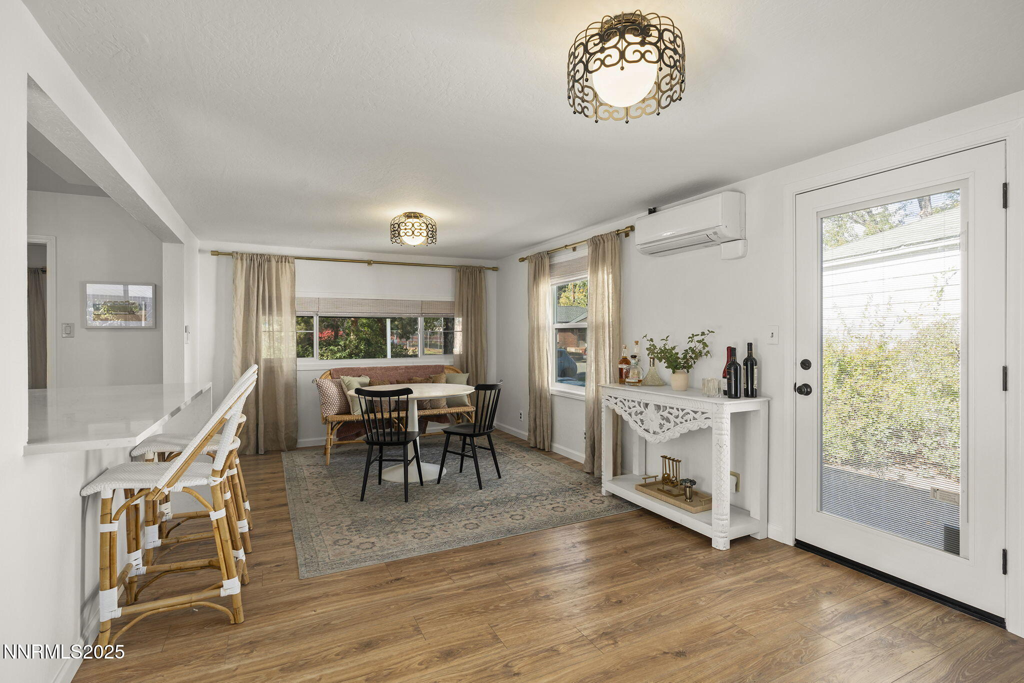 640 Robin Street Reno, NV 89509 - Photo 14 of 25 a view of a dining room with furniture window and wooden floor