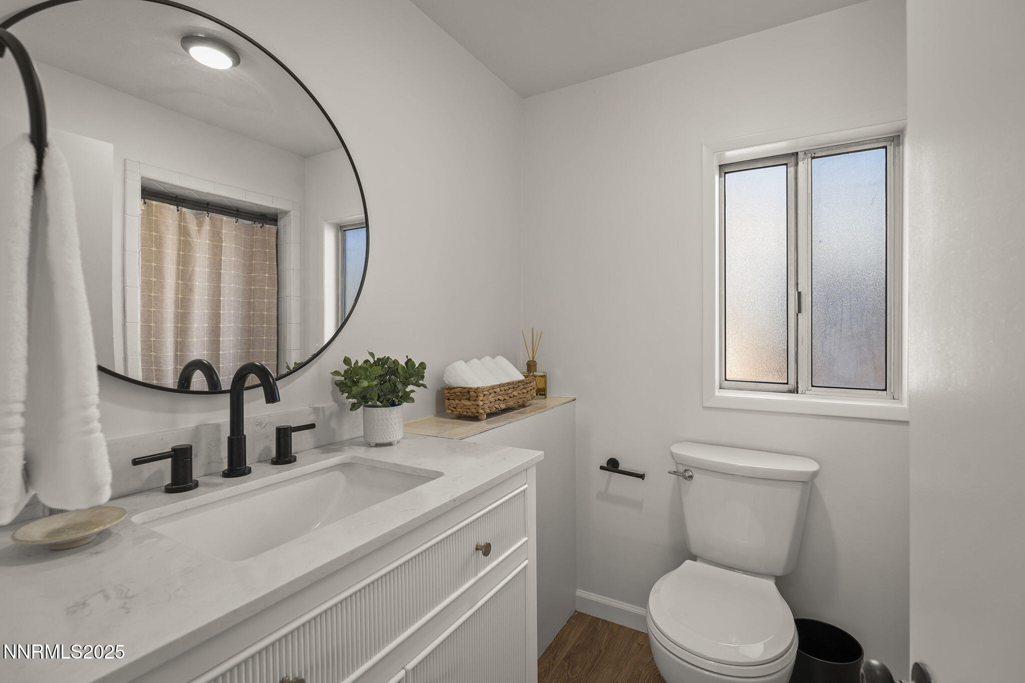 640 Robin Street Reno, NV 89509 - Photo 16 of 25 a bathroom with a toilet sink and mirror