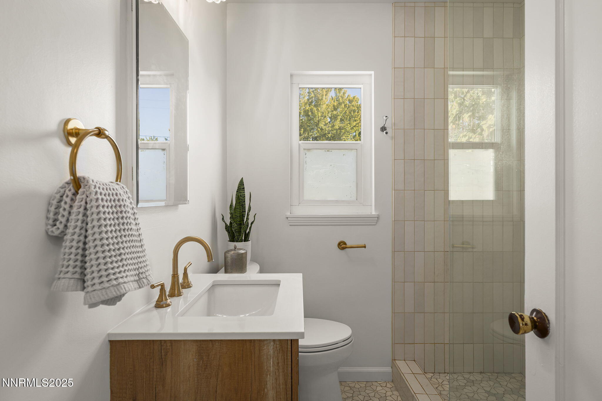 640 Robin Street Reno, NV 89509 - Photo 19 of 25 a bathroom with a sink toilet and shower