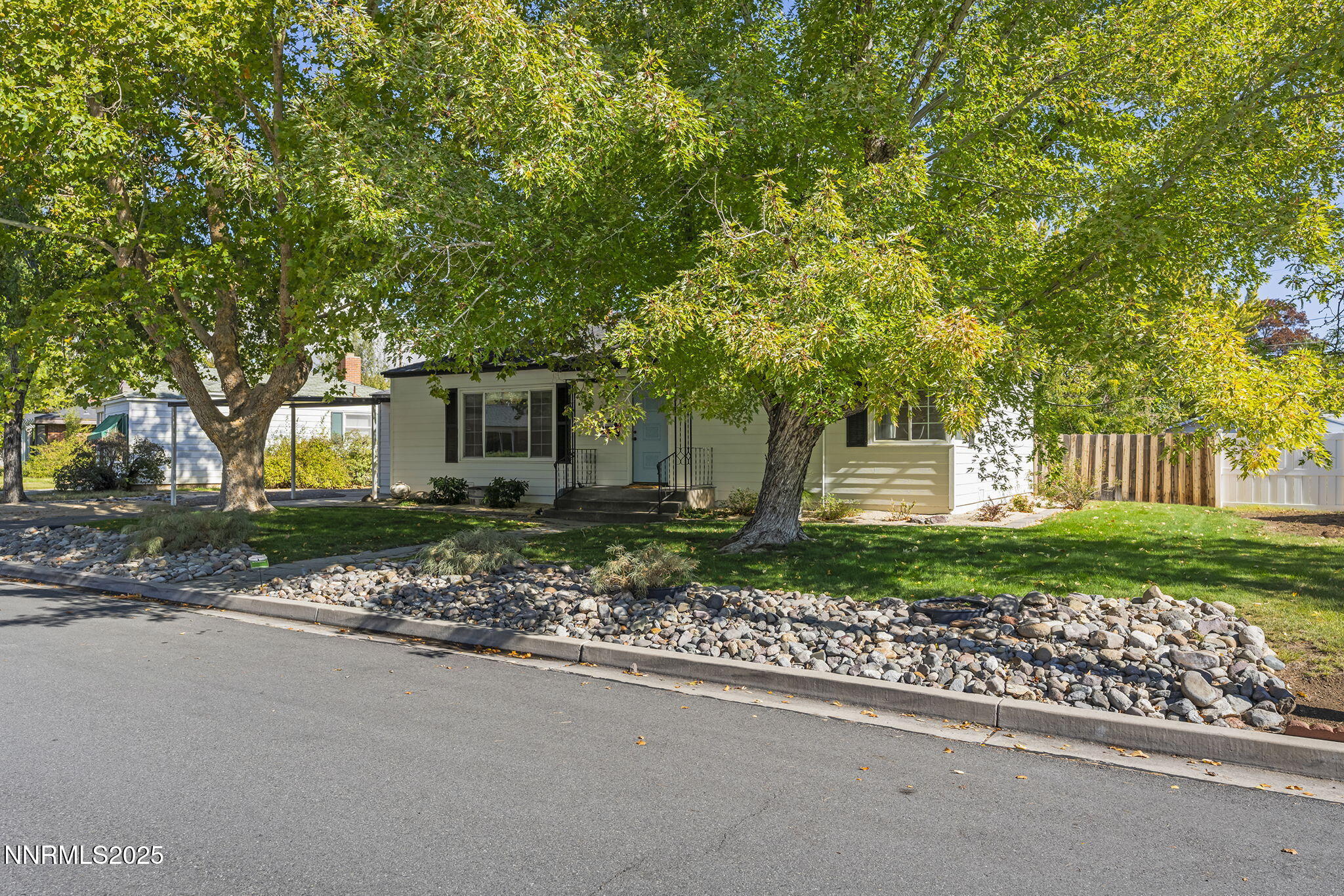 640 Robin Street Reno, NV 89509 - Photo 2 of 25 a front view of a house with a yard and a garden