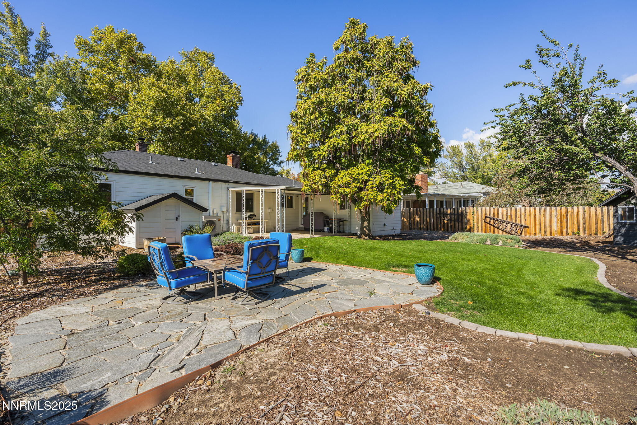 640 Robin Street Reno, NV 89509 - Photo 24 of 25 a view of a house with backyard sitting area and garden