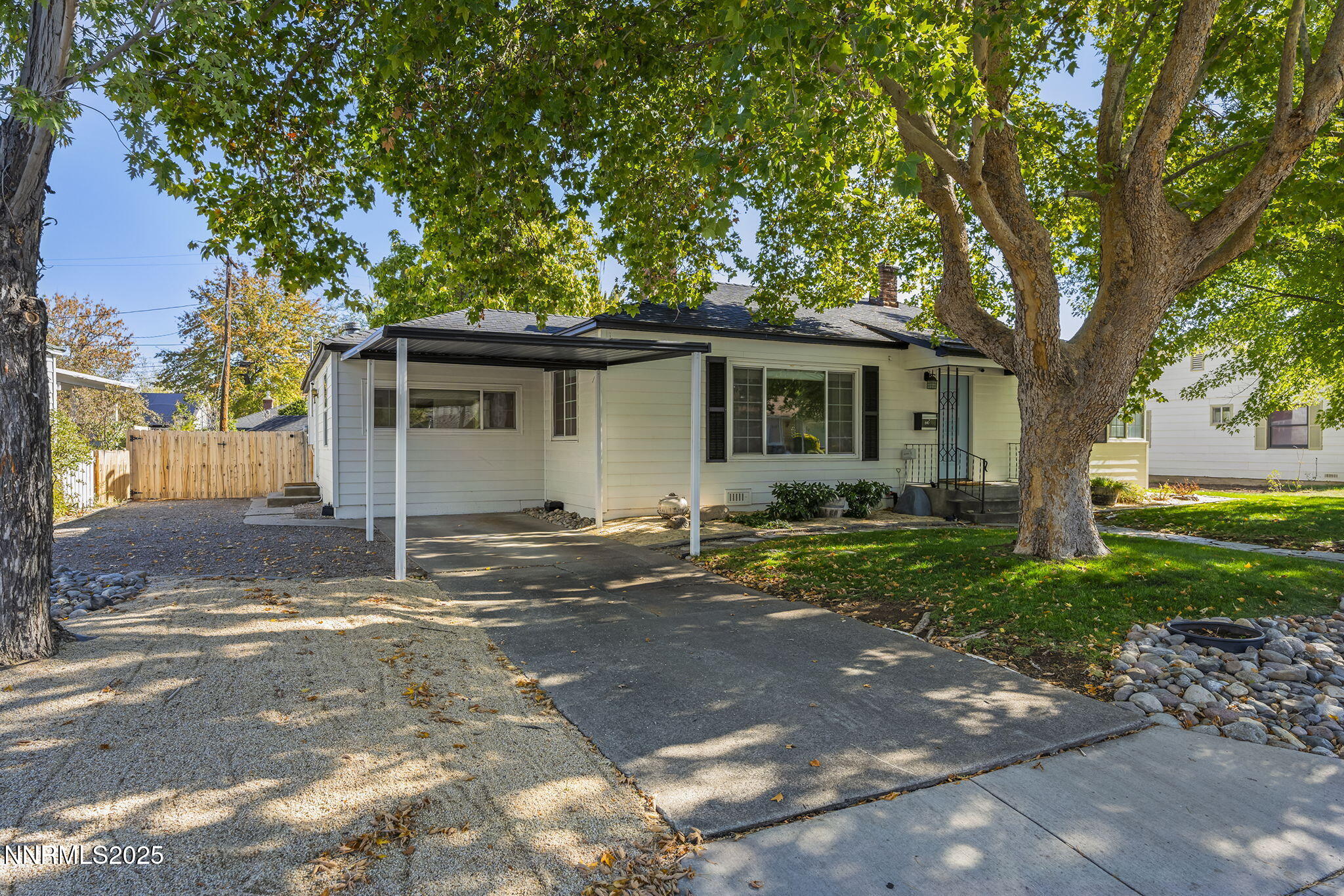 640 Robin Street Reno, NV 89509 - Photo 3 of 25 a backyard of a house with outdoor seating and trees