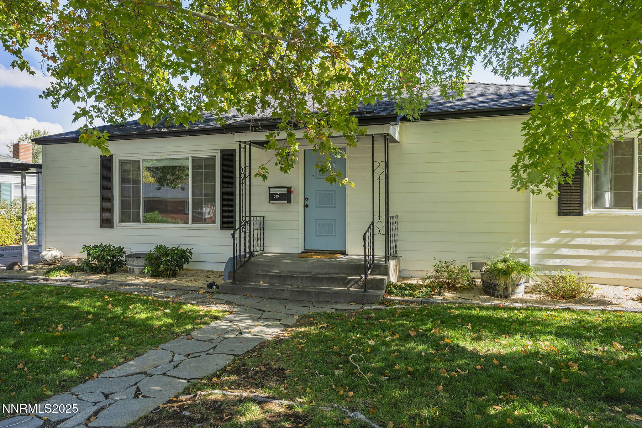 640 Robin Street Reno, NV 89509 - Photo 4 of 25 a front view of a house with garden