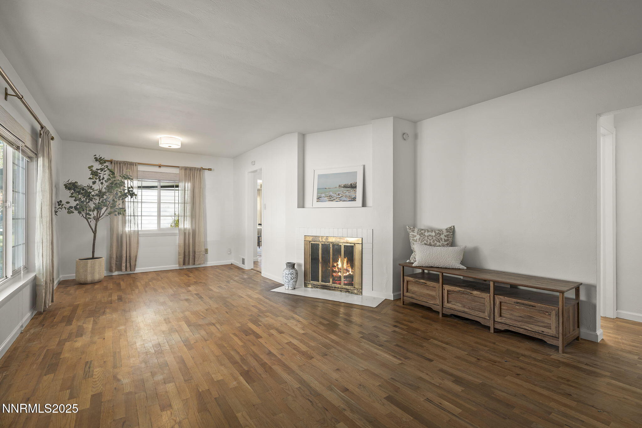 640 Robin Street Reno, NV 89509 - Photo 5 of 25 a view of an empty room with a window and fireplace