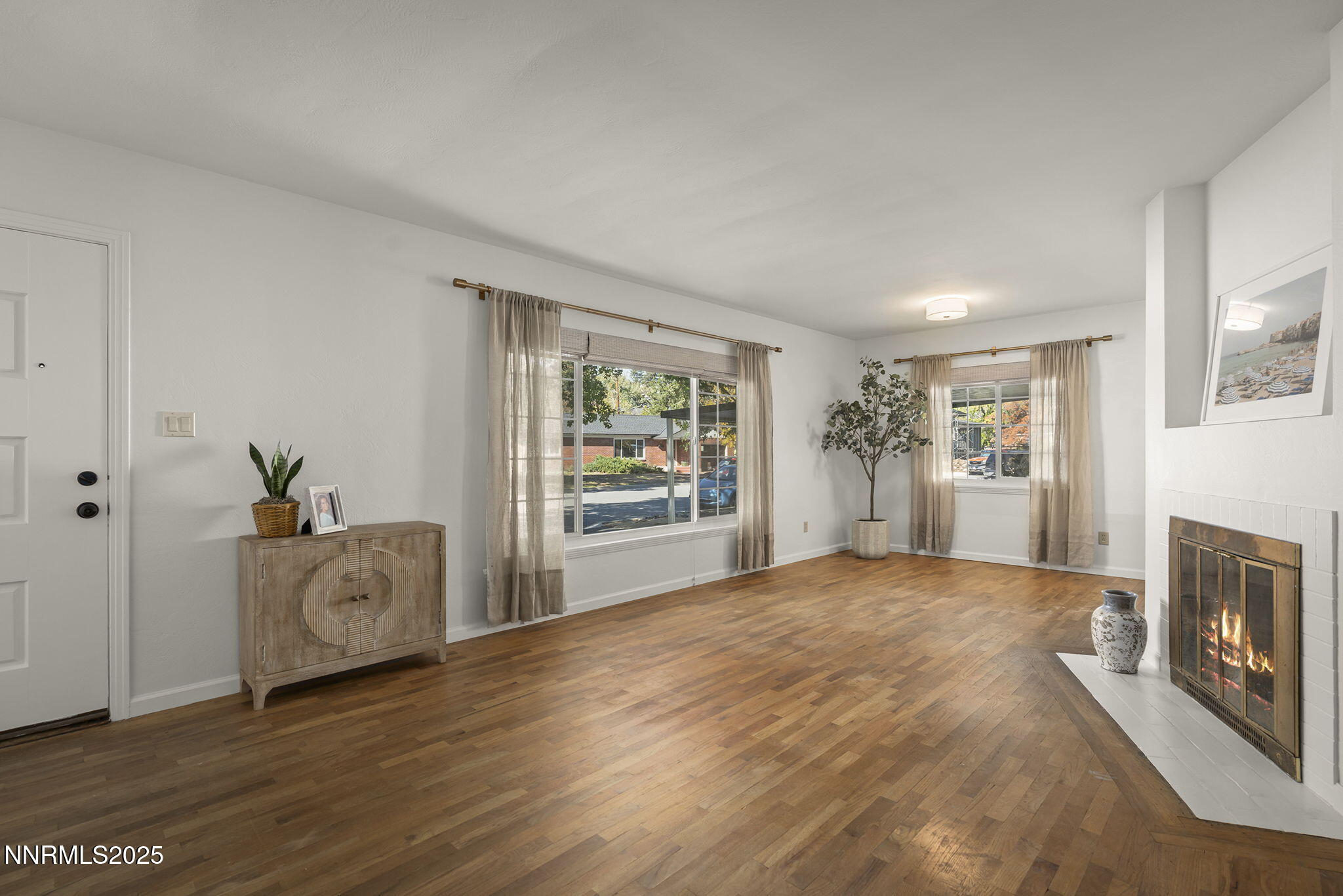 640 Robin Street Reno, NV 89509 - Photo 6 of 25 a view of an empty room with a window and fire place