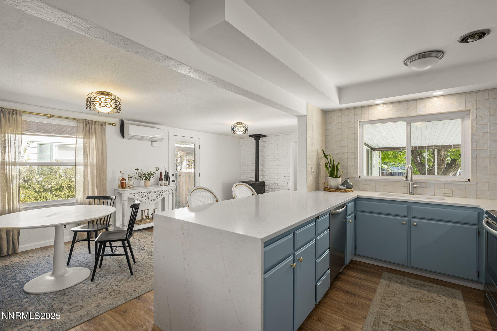 640 Robin Street Reno, NV 89509 - Photo 9 of 25 a kitchen with a sink and stove