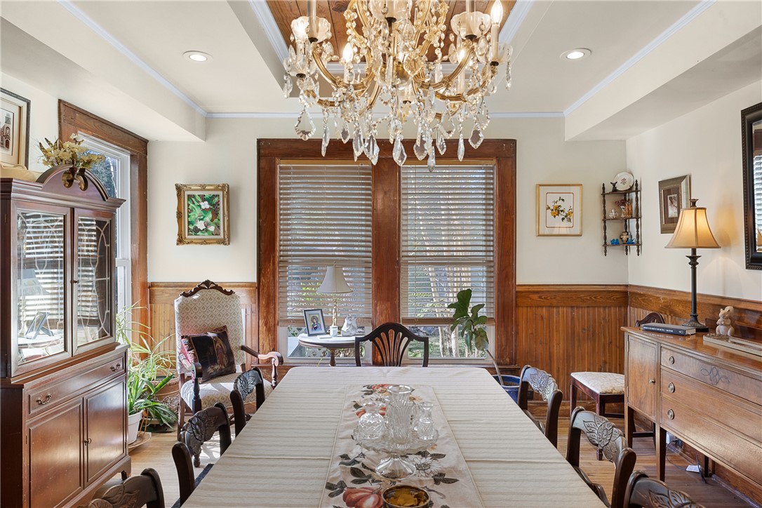 1017 Water Street Navasota, TX 77868 - Photo 11 of 28 a living room with furniture and a chandelier