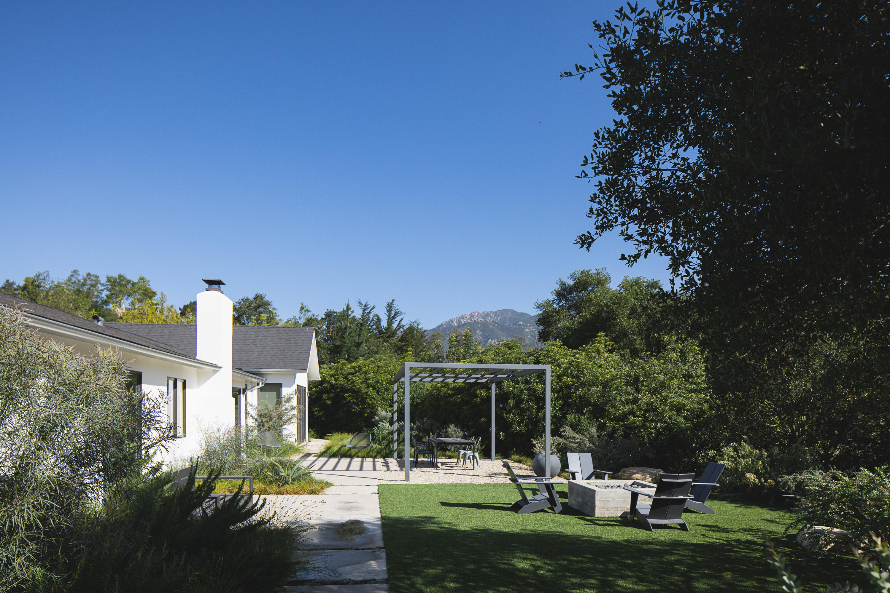 3155 Eucalyptus Hill Road Montecito, CA 93108 - Photo 12 of 30 a view of a building and yard with green space