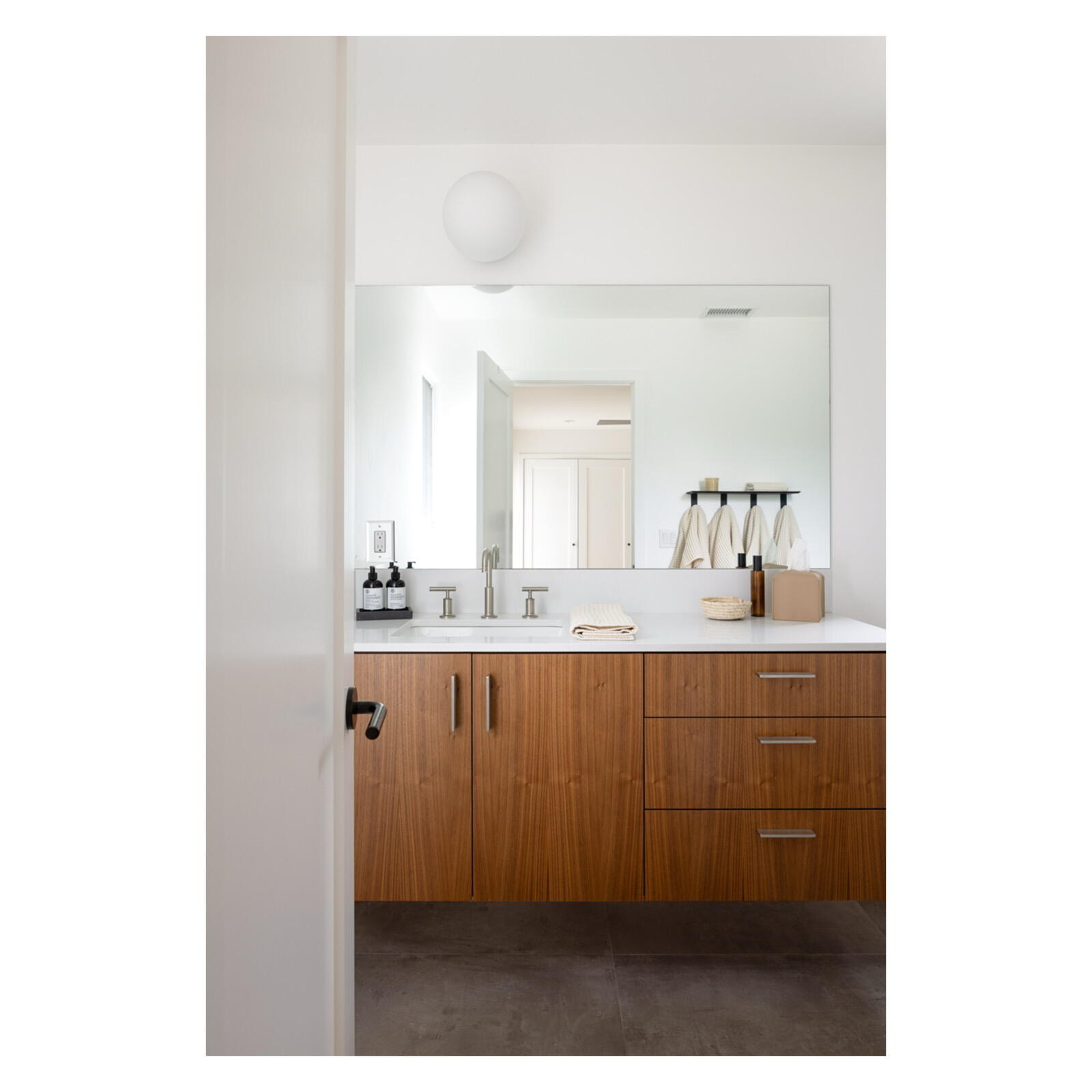3155 Eucalyptus Hill Road Montecito, CA 93108 - Photo 20 of 30 a bathroom with a sink a mirror and a vanity