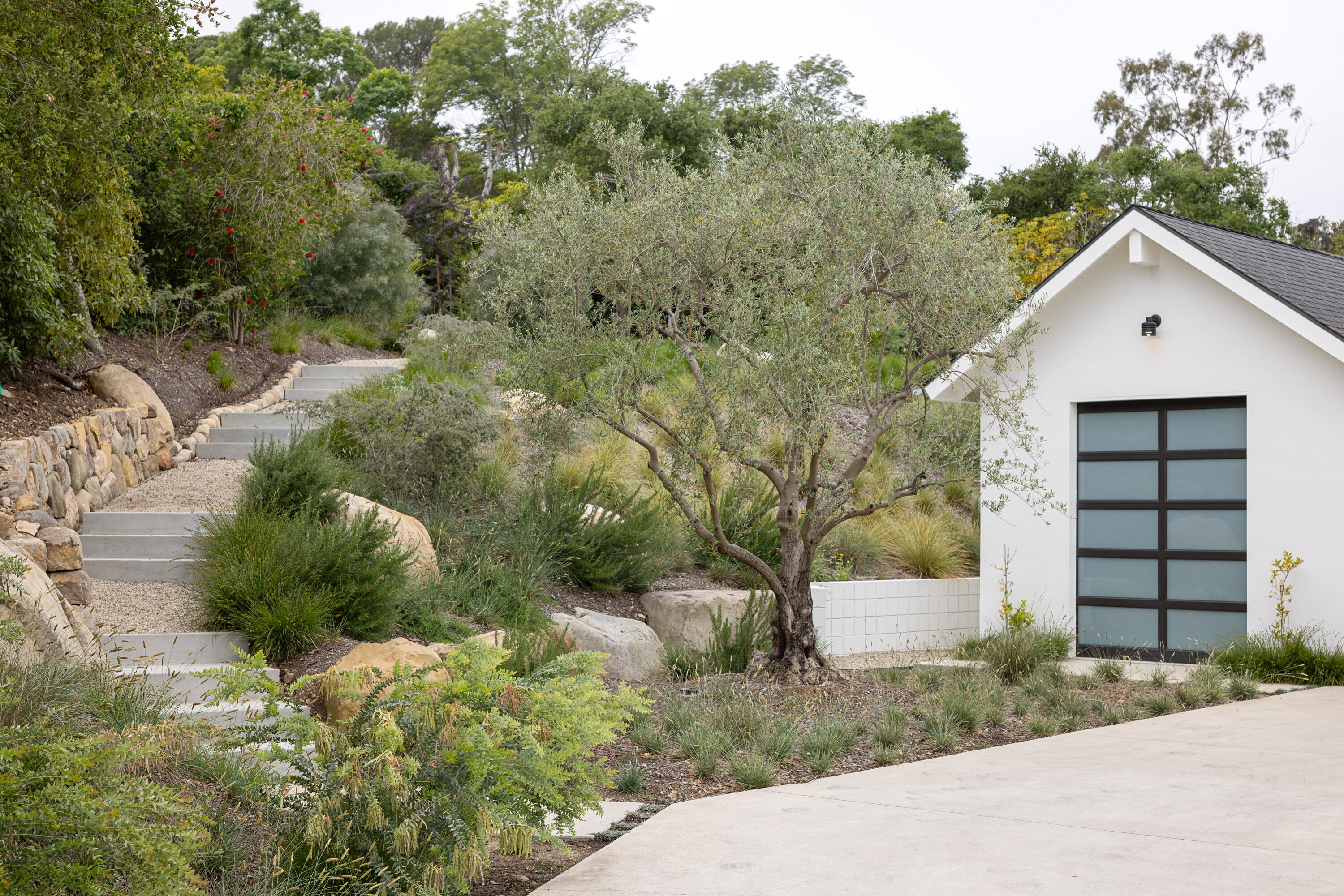 3155 Eucalyptus Hill Road Montecito, CA 93108 - Photo 25 of 30 a view of a house with a yard and garage