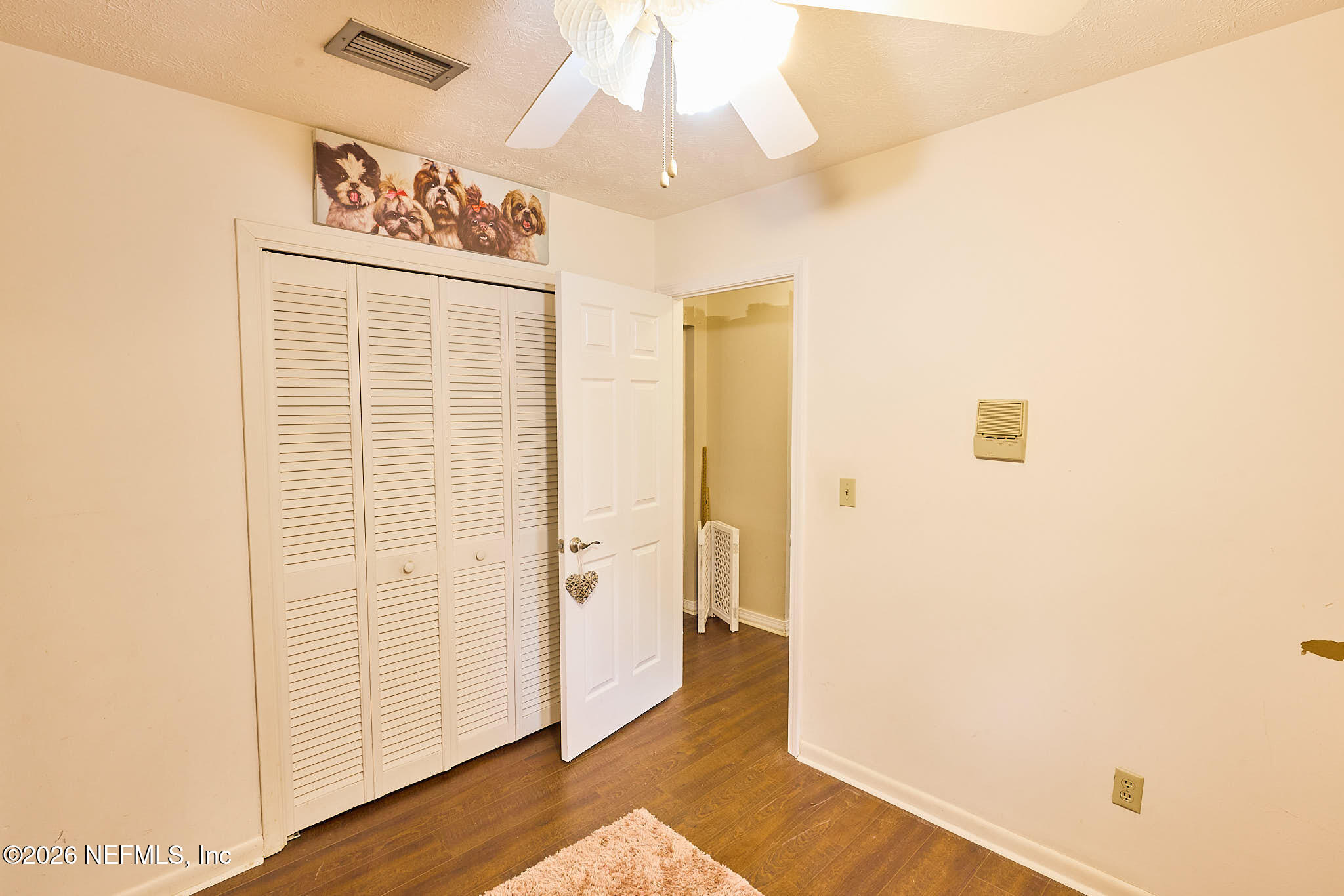 8965 San Rae Road Jacksonville, FL 32257 - Photo 15 of 46 a view of a hallway with wooden floor