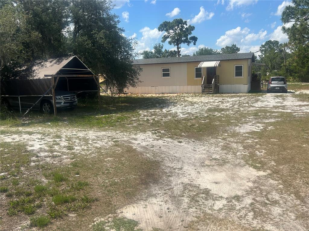 4 Eden Cemetery Road Frostproof, FL 33843 - Photo 3 of 15 front view of a house with a yard